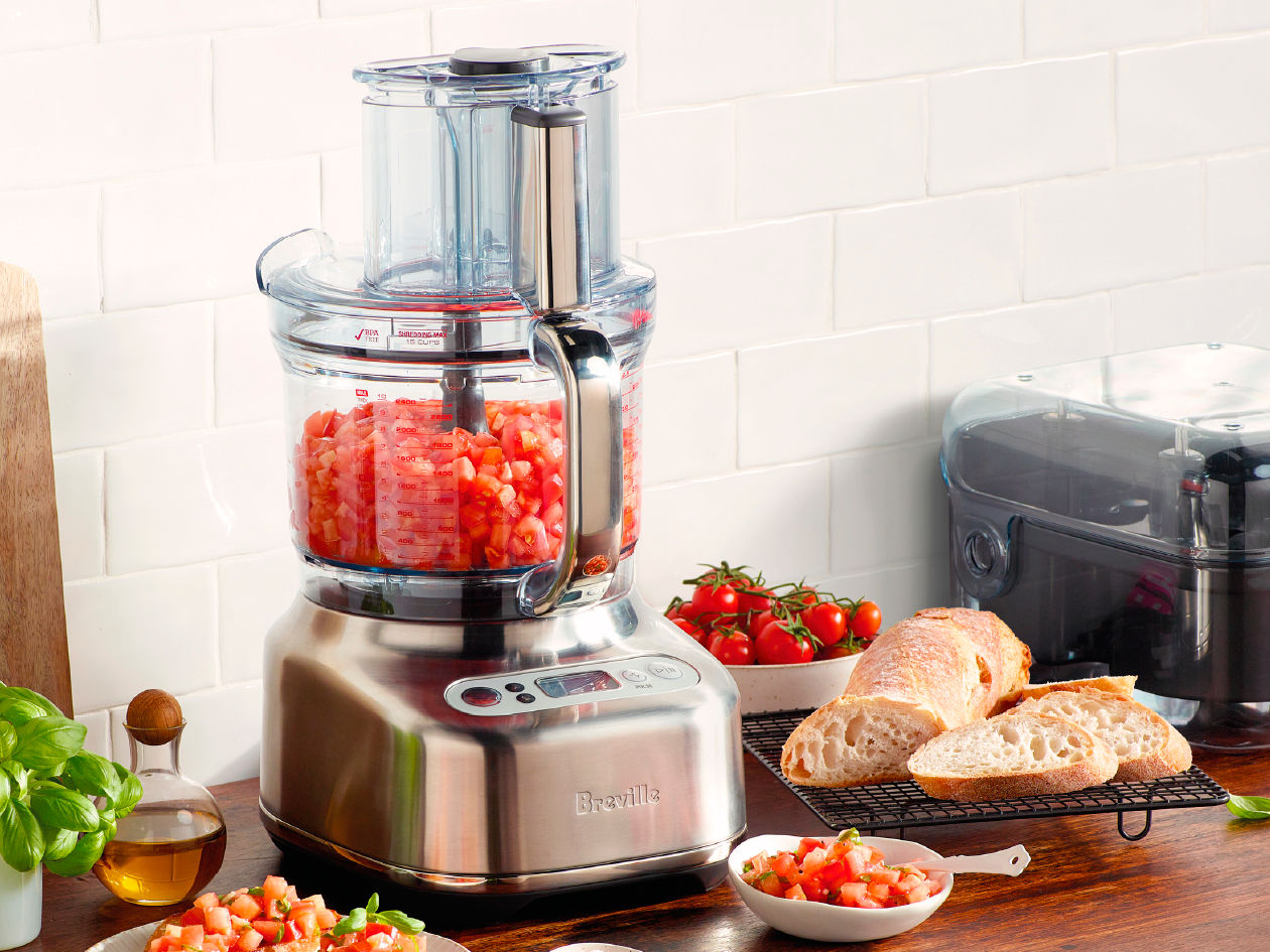 Breville Kitchen Wizz 16 cup large food processor with wide feed chute open, ready for large-scale meal preparation.