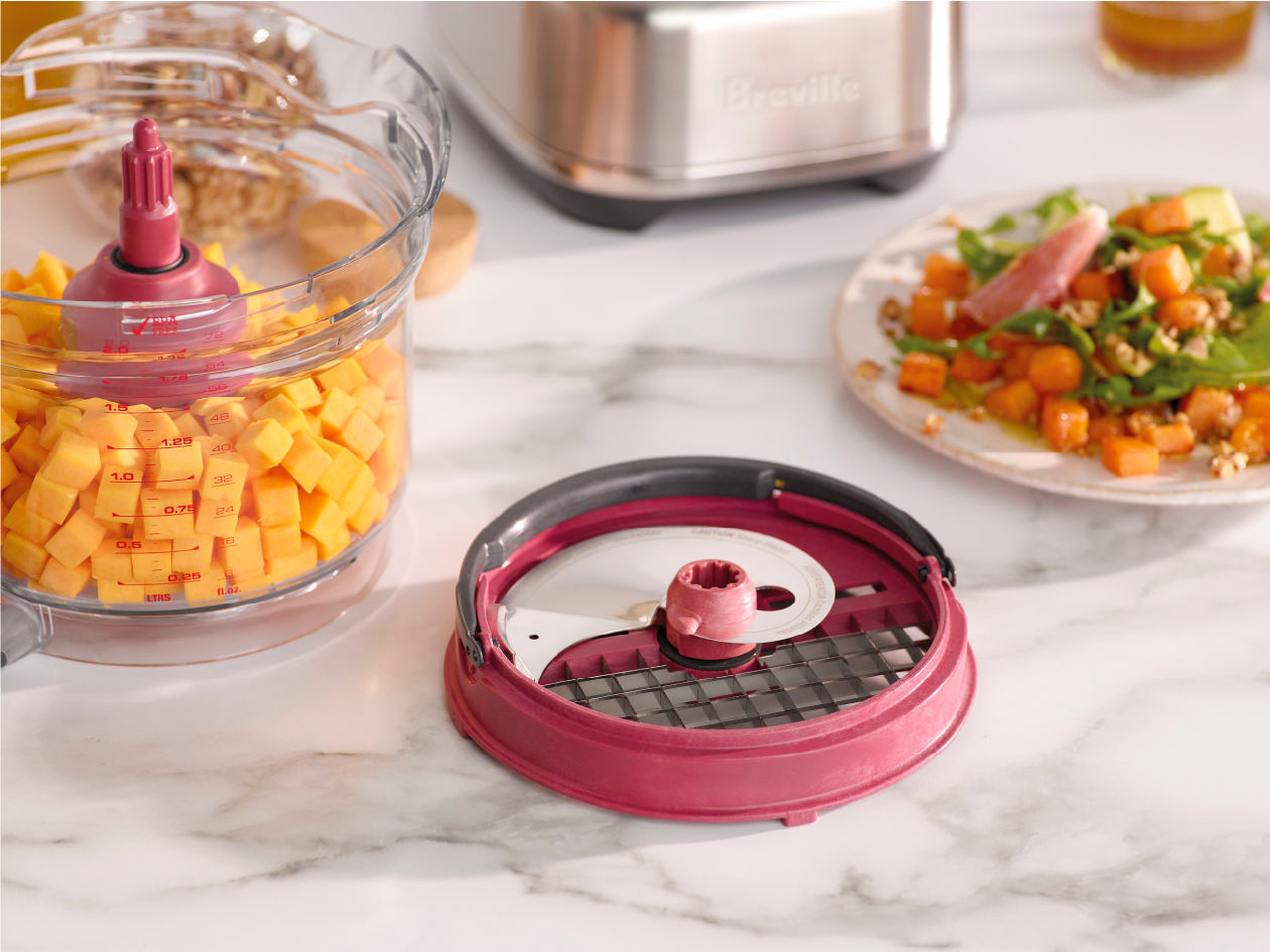 Breville Paradice kit wide-feed dicing attachment slicing and dicing vegetables into precise uniform cubes.