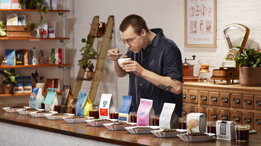 Barista with various Australian coffees.