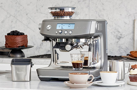 the Barista Pro™ on kitchen bench with latte glasses and barista tool kit