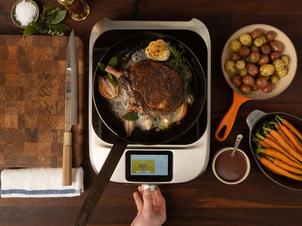 Steak searing on a pan on a Control Freak Home.