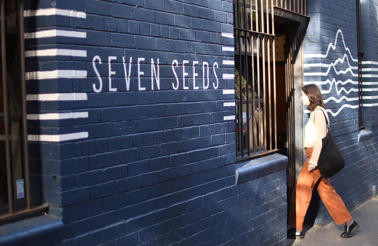 Man and woman at seven seeds coffee counter