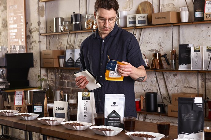 barista with coffees